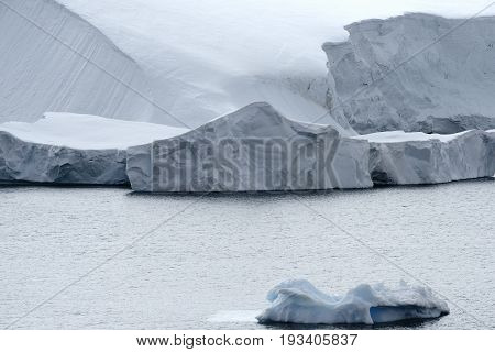 Calving glacier and large icebergs at Paradise Bay, Antarctic Peninsula