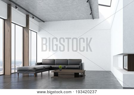 Side view of a white living room interio with a concrete floor panoramic windows a fireplace a long gray sofa and a narrow coffee table. 3d rendering mock up