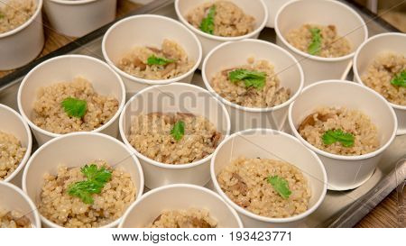 Brown Rice Is Divided Into Portions Close-up. Macrobiotics And Healthy Nutrition.