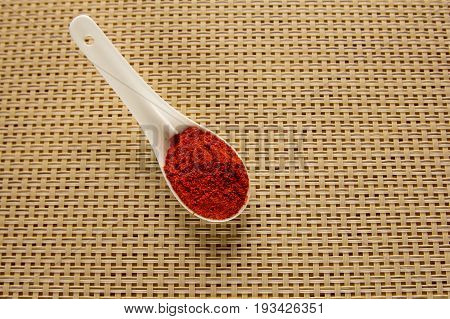 Spices in spoons on the table. Seasoning in powder.