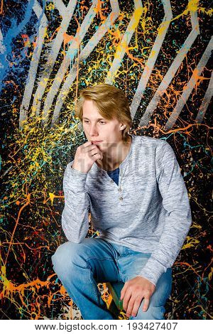 Young caucasian attractive guy posing in studio