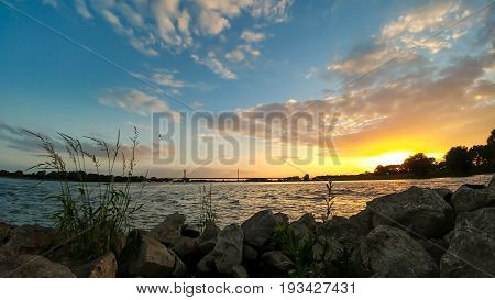 sundown at the rhine bridge Rees Germany wide angle