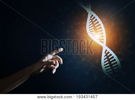 Close of man hand presenting DNA molecule research as concept. Mixed media