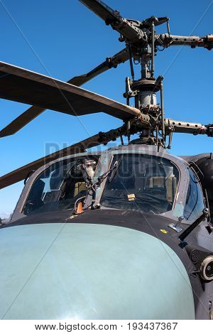 Pushkin, Russia - June 5, 2017: Details of the rotor and part of the body of modern military helicopters closeup. In the foreground the pilot's cabin.