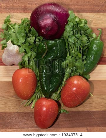 Fresh vegetables ready for use in homemade salsa.