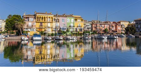 VALENCIA, SPAIN - JUNE 13, 2017: Panorama of boats and colorful houses of Port Saplaya in Valencia, Spain