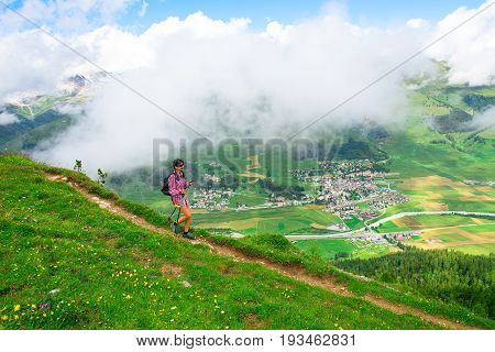 Girl during an excursion in Engadin valley above Zuoz village.