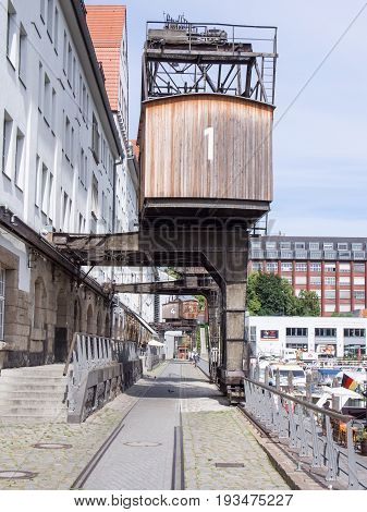 BERLIN GERMANY - JUNE 21 2017: Old Wooden Crane In Tempelhofer Hafen Meaning Harbor of Tempelhof In German Language In Berlin