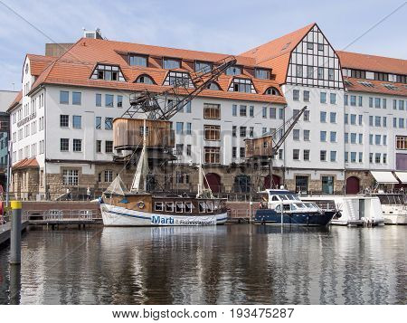 BERLIN GERMANY - JUNE 21 2017: Old Wooden Cranes And Boats In Tempelhofer Hafen Meaning Harbor of Tempelhof In German Language In Berlin