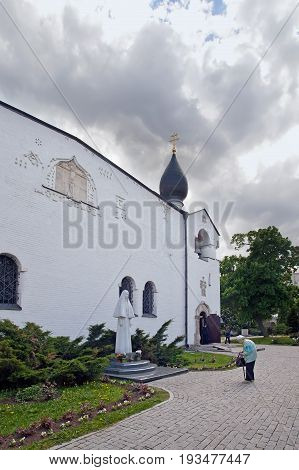Moscow Russia - May 27 2017: People at Pokrovsky Cathedral Saints Martha and Mary Convent. Northern facade with a sculpture of the princess Elizaveta. Moscow. Russia