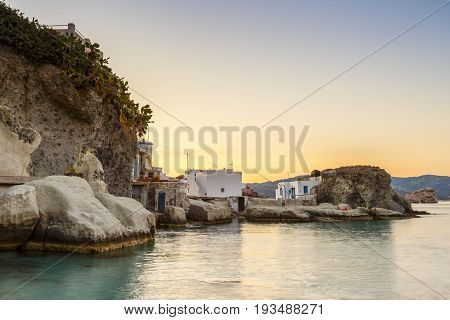 Boat houses in fishing village of Goupa on Kimolos island in Greece.