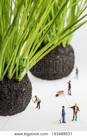 miniature landscsape gardener dig out the grass