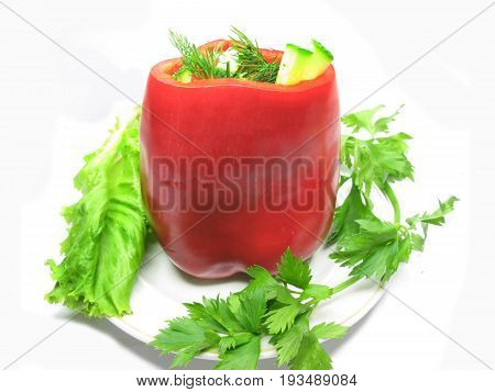 stuffed red pepper with parsley and fennel on the plate