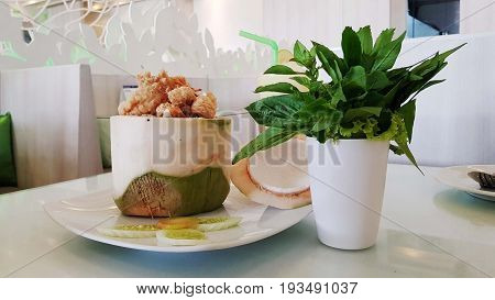 coconut rice, coconut sweet rice,Tasty rice in coconut on table.