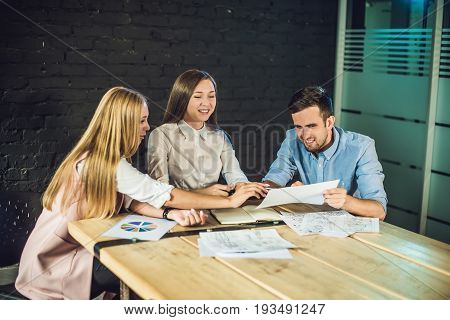 Young Team Of Coworkers Watching Storyboard For Shooting Video In Modern Coworking Office. Teamwork