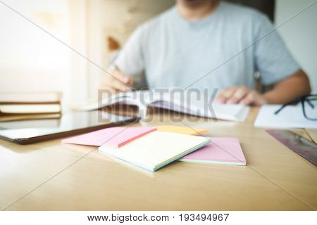 Close up of studying student hands writing in book during lecture education students college of university Reading Learning and Exam. Education concept.