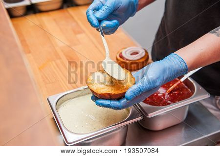 Chief Cook Preparing Fresh Burger In The Kitchen.burger Restaurant Menu Cooking Process. The Cook Pu