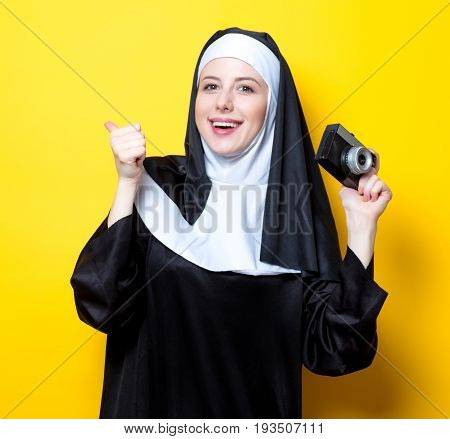 Young Happy Nun With Vintage Photo Camera