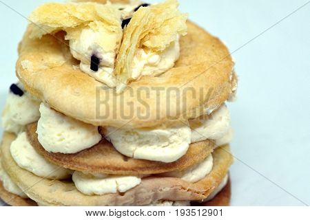 Close view on cake called italian cremeschnitte isolated on white background