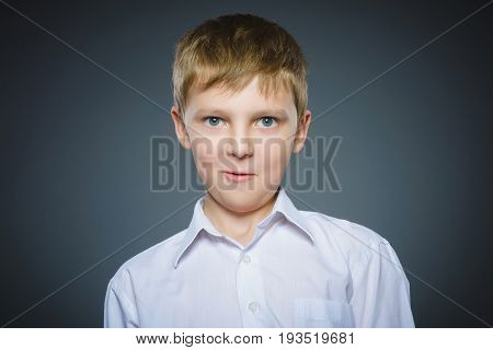 Closeup Portrait of happy boy going surprise isolated on gray background.
