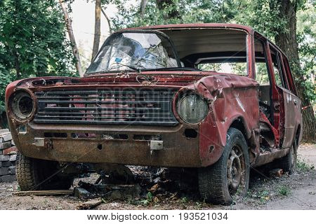 Old broken abandoned rusty retro car, a Soviet car