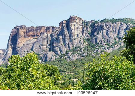 Green trees and rock mountains at sunset in Greece, Corfu