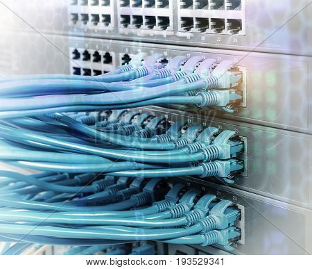 Network cables in switch and firewall in cloud computing data center server rack