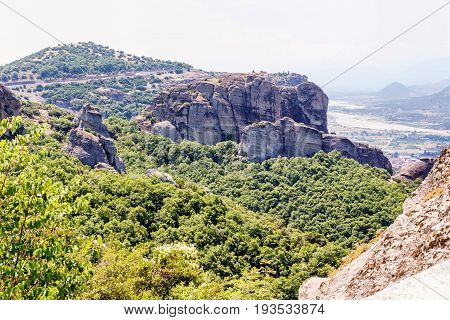 Green trees and rock mountains at sunset in Greece, Corfu