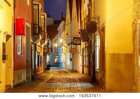 Medieval Bremen street Schnoor with half-timbered houses in the centre of the Hanseatic City of Bremen at night, Germany