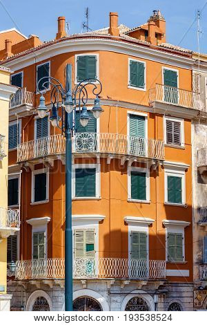 Old orange apartment building architecture of Greece, Corfu island