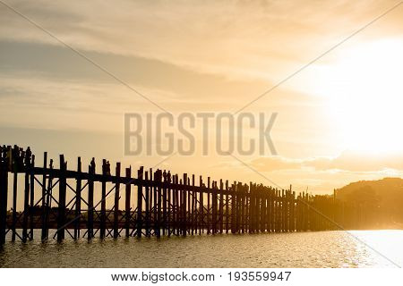 Ubein bridge World longest wooden bridge at sunrise at Taungthaman Lake Amarapura Mandalay Myanmar Burma