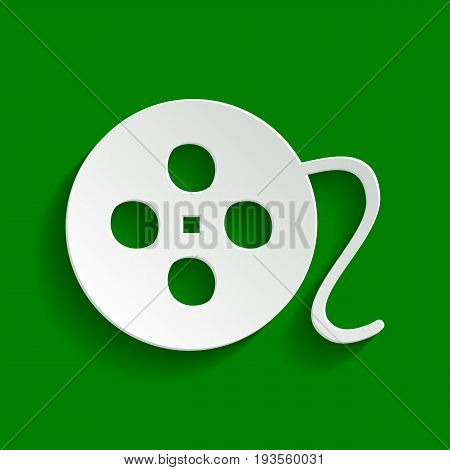 Film circular sign. Vector. Paper whitish icon with soft shadow on green background.