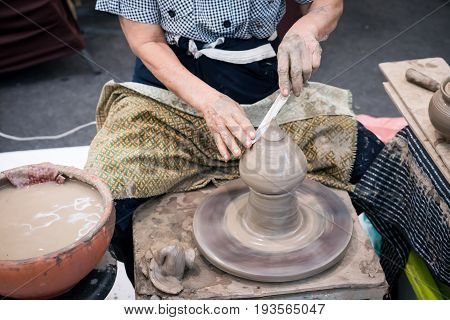 Shaping Decorative Clay Hollow Sculpture On Pottery Wheel With Knife