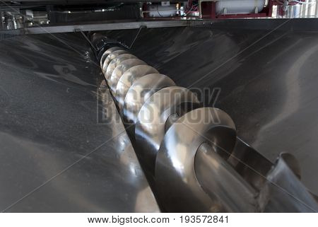 Wine process with grape harvest at working with destemmer machine photo