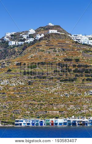 Klima and Plaka villages on the coast of Milos island as seen from the ferry.