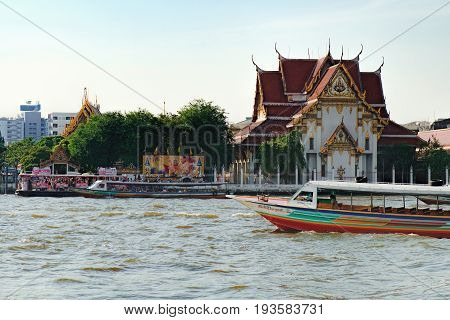 Bangkok, Thailand - January 8, 2016: Wat Rakangkositaram Woramahavihan is Buddhist Temple which located on the banks of the Chao Phraya River in the tourist center of Bangkok.