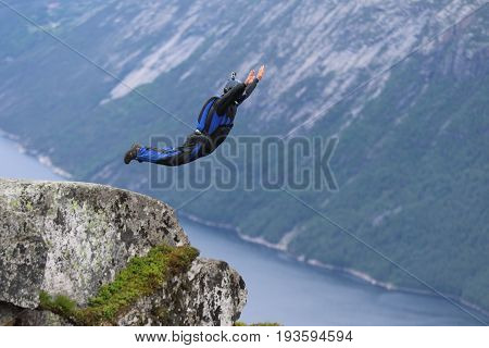 Skydiving over beautiful Norway. Clouds, sun and sky