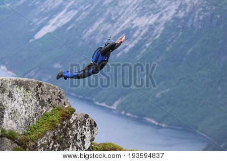 Skydiving over beautiful Norway. Clouds, sun and sky