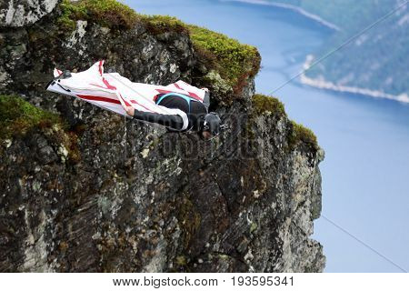 Skydiving over beautiful Norway. Clouds, sun and sky