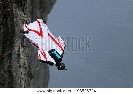 Skydiving over beautiful Norway. Clouds, sun and sky