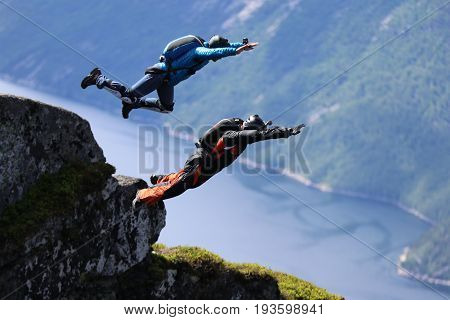 Skydiving over beautiful Norway. Clouds, sun and sky