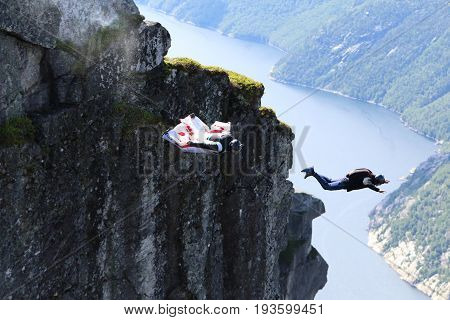Skydiving over beautiful Norway. Clouds, sun and sky