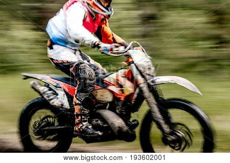 blurred motion close-up motorcycle enduro in motorcycle