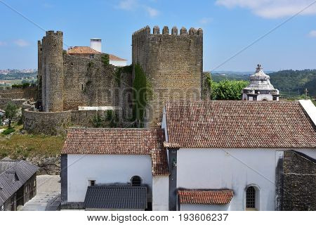 Obidos castle and village. Obidos is an ancient medieval Portuguese village from the 11th century still inside castle walls. Obidos Portugal