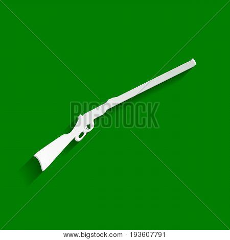 Hunting rifle icon vector illustration. Silhouette gun. Vector. Paper whitish icon with soft shadow on green background.