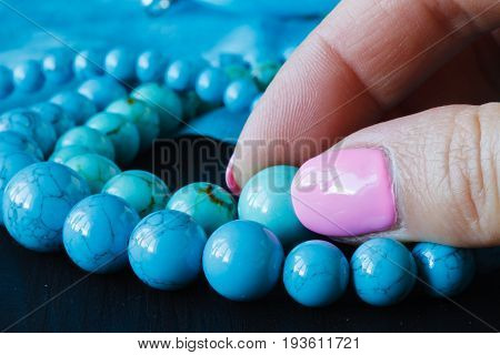 Ewelry Made Of Turquoise On A Woman's Hand