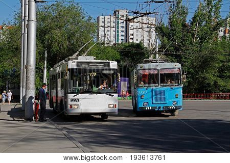 Volgograd Russia - June 13 2015: Passenger trolleybus Trolza-5275.05 "Optima" and trolleybus technical assistance KGT-1 standing at the final bus stop in Volgograd