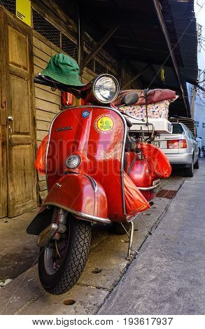 Scooter Parked At An Urban Street In Old Townhouse