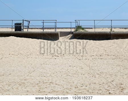 beach sky and railings at crosby in merseyside