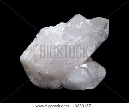 Clear quartz cluster on black fabric background